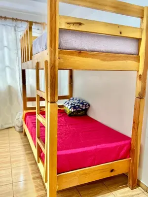 Cama o camas de una habitación en Hostal Amate Taxco