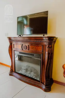 Una televisión o centro de entretenimiento en Hotel Puebla de Antaño
