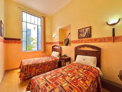 Cama o camas de una habitación en Hotel La Alhondiga