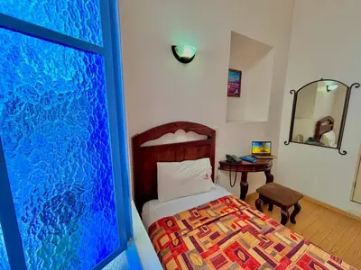 Cama o camas de una habitación en Hotel La Alhondiga