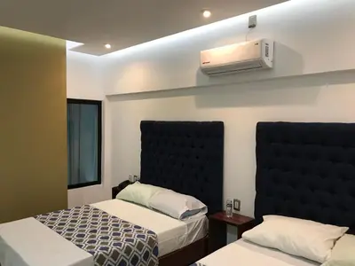 Cama o camas de una habitación en Hotel Plaza Amalia