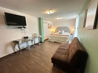 Una televisión o centro de entretenimiento en Colombe Hotel Boutique