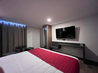 Una televisión o centro de entretenimiento en Hotel Granada