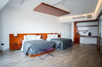 Cama o camas de una habitación en Sonata Hotel Puebla Angelópolis Distrito Sonata