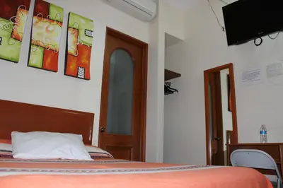 Cama o camas de una habitación en Hotel Oaxaca Mágico