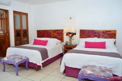 Cama o camas de una habitación en Boutique Pueblo Lindo