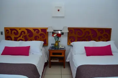 Cama o camas de una habitación en Boutique Pueblo Lindo