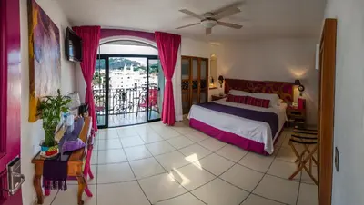 Cama o camas de una habitación en Boutique Pueblo Lindo