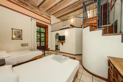 Cama o camas de una habitación en Hotel Colonial