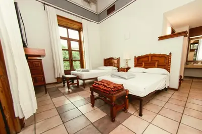 Cama o camas de una habitación en Hotel Colonial