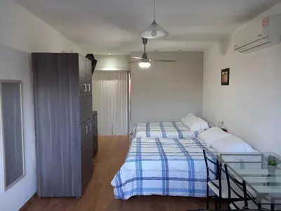 Cama o camas de una habitación en Habitaciones amuebladas Veracruz Logos