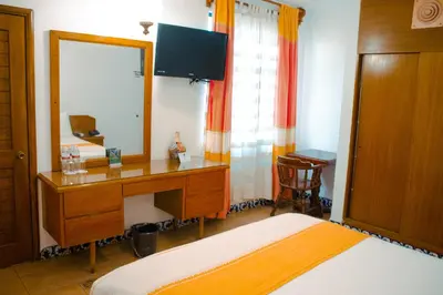 Cama o camas de una habitación en Hotel Oaxaca Real