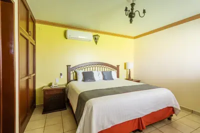 Cama o camas de una habitación en Hotel Ángel Inn