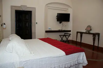 Cama o camas de una habitación en Hotel Hacienda Vista Hermosa