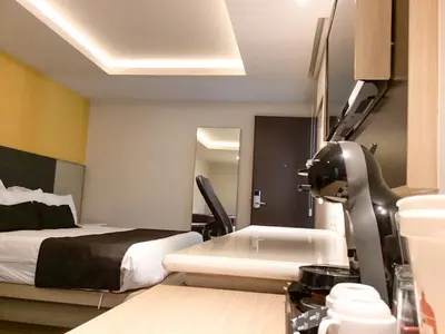 Cama o camas de una habitación en Plaza Poblana