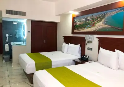 Cama o camas de una habitación en Hotel Lois Veracruz