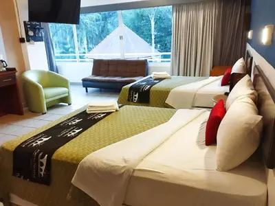 Cama o camas de una habitación en Hotel Puente Nacional & Spa