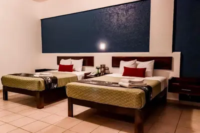 Cama o camas de una habitación en Hotel Puente Nacional & Spa