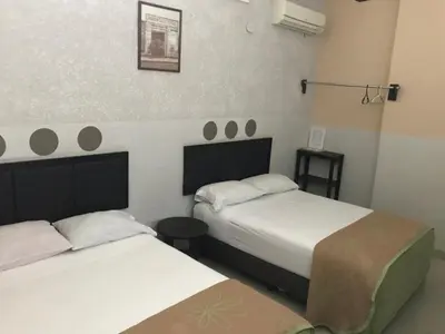 Cama o camas de una habitación en Hotel Central ParQ