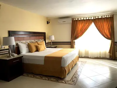 Cama o camas de una habitación en Centro Hotel Villa las Margaritas