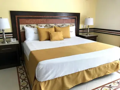 Cama o camas de una habitación en Centro Hotel Villa las Margaritas