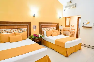 Cama o camas de una habitación en Centro Hotel Villa las Margaritas