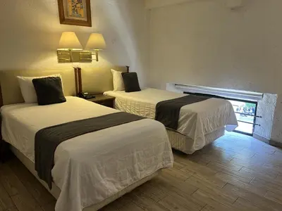 Cama o camas de una habitación en Hotel Del Portal, Puebla