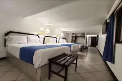 Cama o camas de una habitación en Hotel Del Portal, Puebla