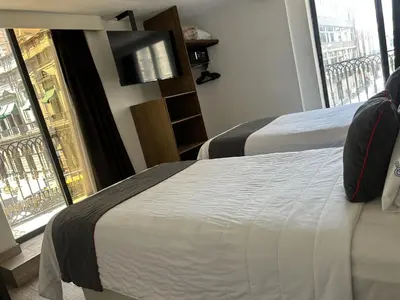 Cama o camas de una habitación en Hotel Del Portal, Puebla