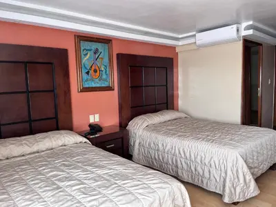 Cama o camas de una habitación en Hotel Gilfer Puebla Centro Histórico