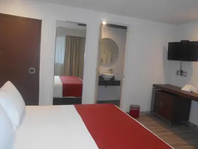 Cama o camas de una habitación en Hotel Puente Real