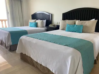 Cama o camas de una habitación en Astur Hotel & Residence
