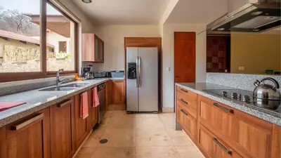 Una cocina o zona de cocina en Celeste Beach Residences Huatulco Curamoria Collection