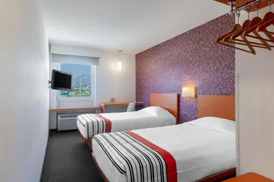 Cama o camas de una habitación en City Express Junior by Marriott Tuxtla Gutierrez Poliforum