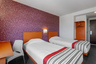 Cama o camas de una habitación en City Express Junior by Marriott Tuxtla Gutierrez Poliforum