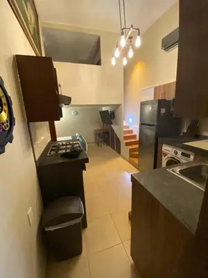 Una cocina o zona de cocina en Loft Frente a la Playa!!!!
