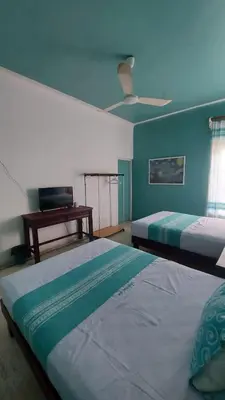 Cama o camas de una habitación en Delphinus Inn