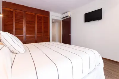 Cama o camas de una habitación en Hotel Suites Villasol