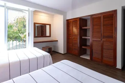 Cama o camas de una habitación en Hotel Suites Villasol