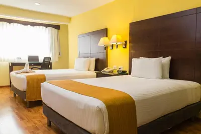 Cama o camas de una habitación en Hotel Madan Cárdenas