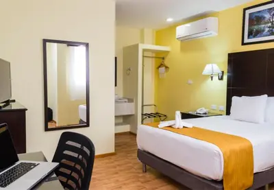 Cama o camas de una habitación en Hotel Madan Cárdenas