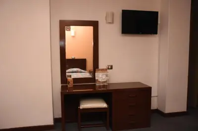 Una televisión o centro de entretenimiento en Hotel Maria Victoria Xalapa