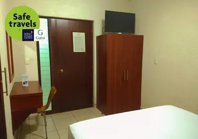Cama o camas de una habitación en Hotel Guivá Huatulco