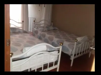 Cama o camas de una habitación en CIUDAD DE MEXICO UNAM Guest House Casa de Huespedes