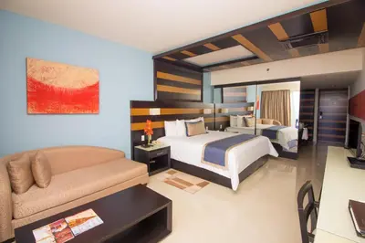 Cama o camas de una habitación en Secrets Huatulco Resort & Spa
