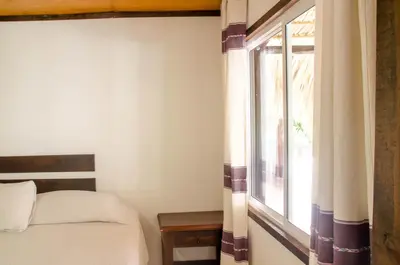 Cama o camas de una habitación en Bungalows Zicatela