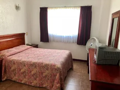 Cama o camas de una habitación en Hotel Roma