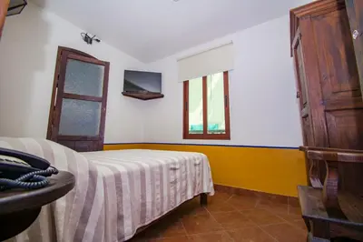 Cama o camas de una habitación en Meson del Alferez Xalapa