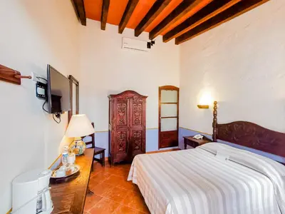 Cama o camas de una habitación en Meson del Alferez Xalapa