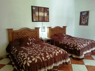 Cama o camas de una habitación en Hotel Imperial Jojutla